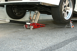 Illustration for article titled And You Will Know Us by the Trail of Parts: Using a Floor Jack and Jack Stands